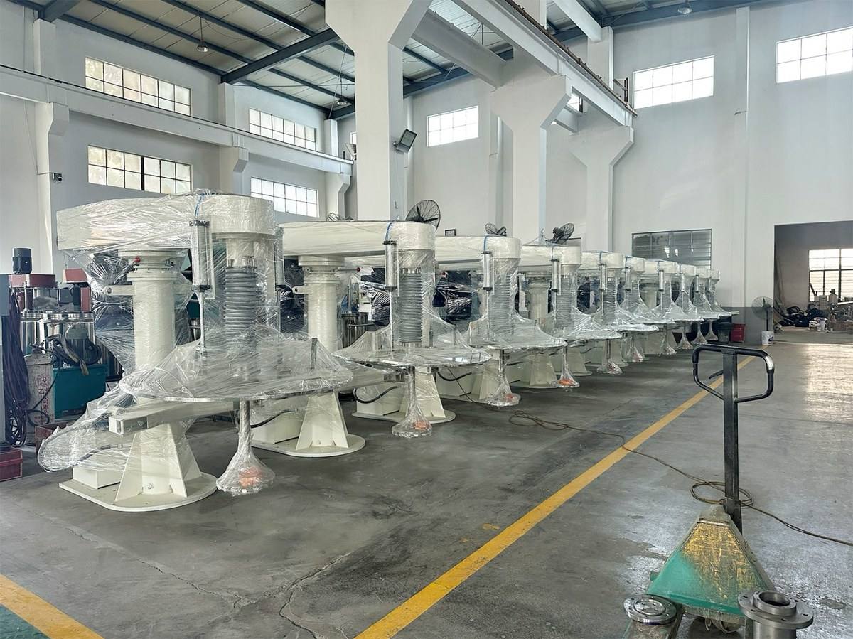 Row of POLYC high-speed dispersers installed in the workshop, ready for coating production